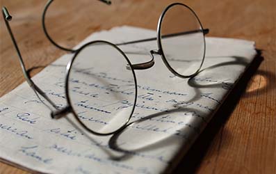 Reading Glasses on Hand Written Letter