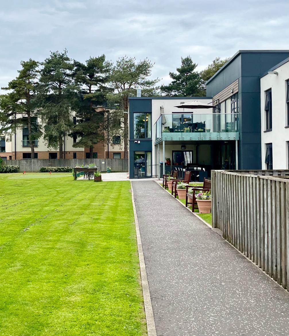 modern care home exterior with landscaped garden