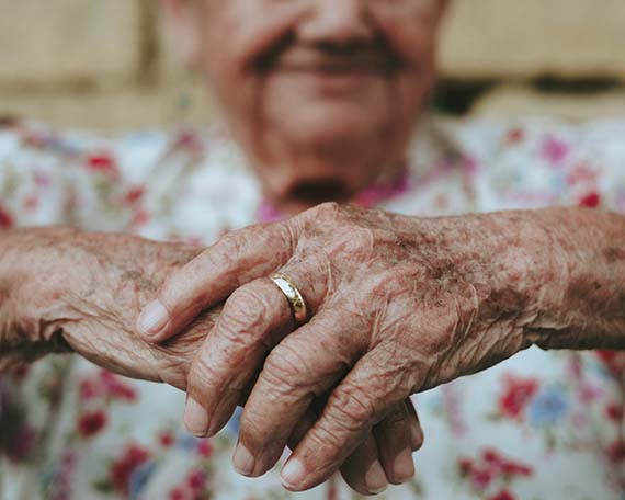 Elderly Woman Holding Hands