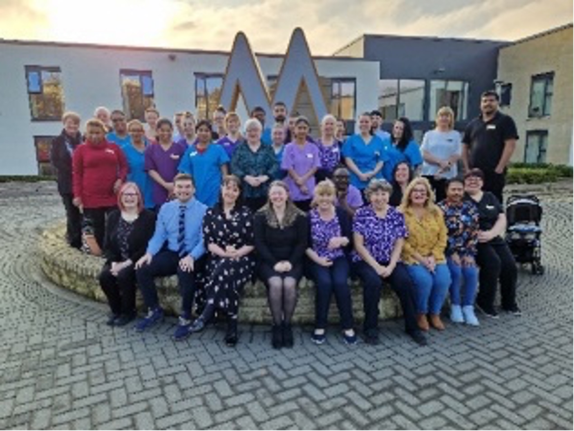 Manor Grange Staff Sitting Outside