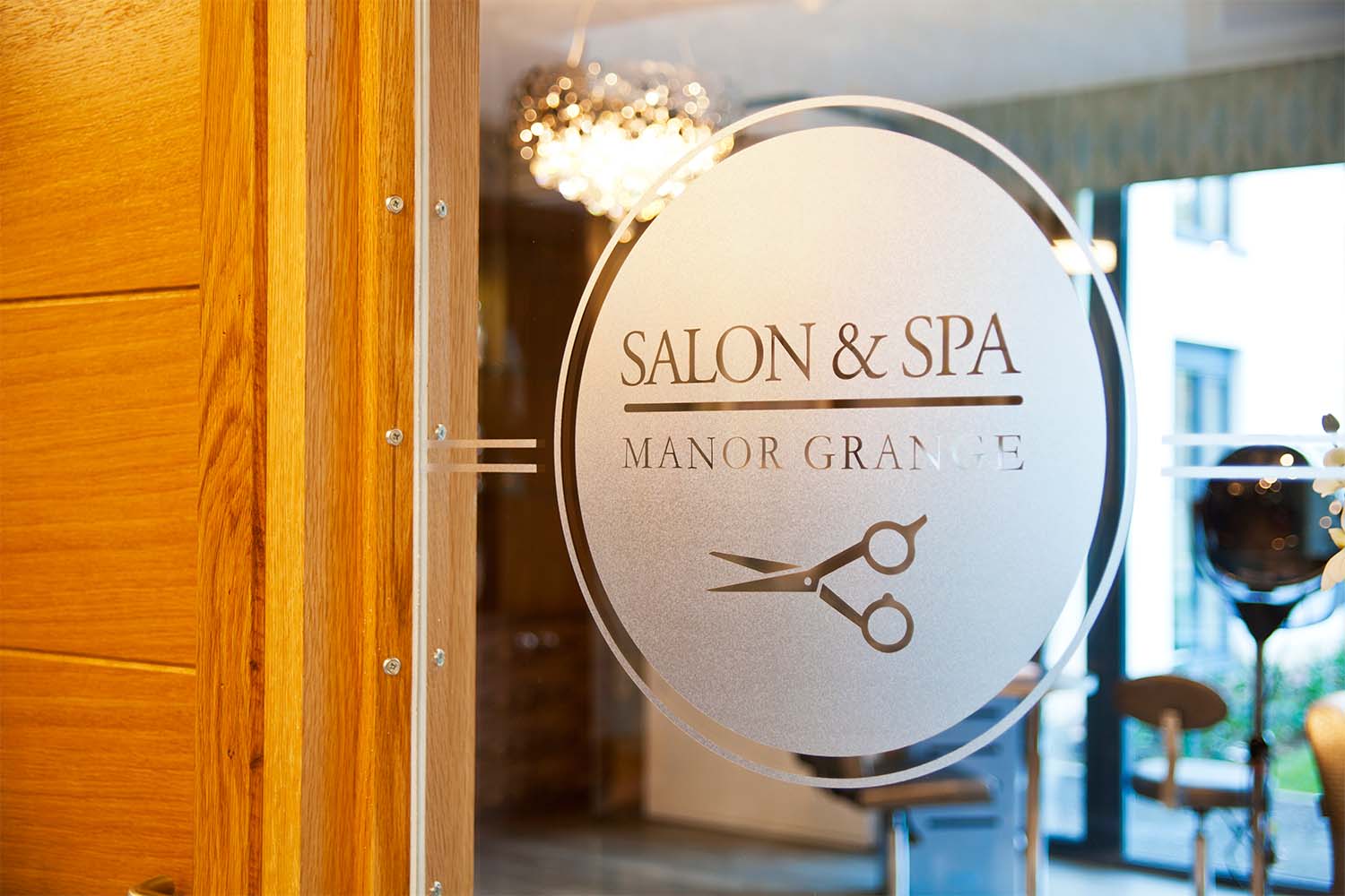 sign on glass door for salon and spa room