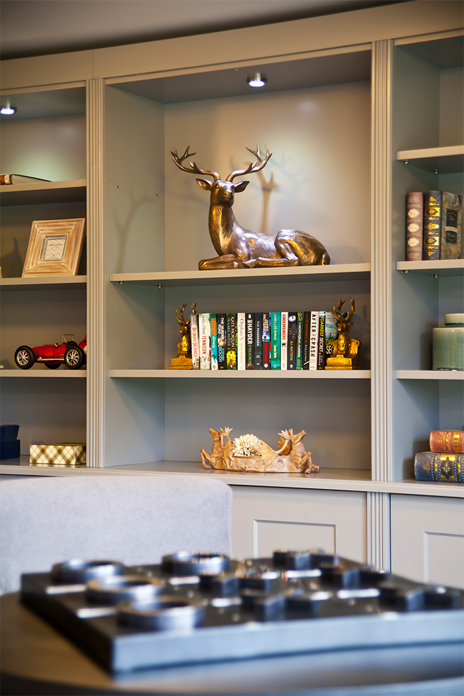 bookshelf in a care home with books and decorations