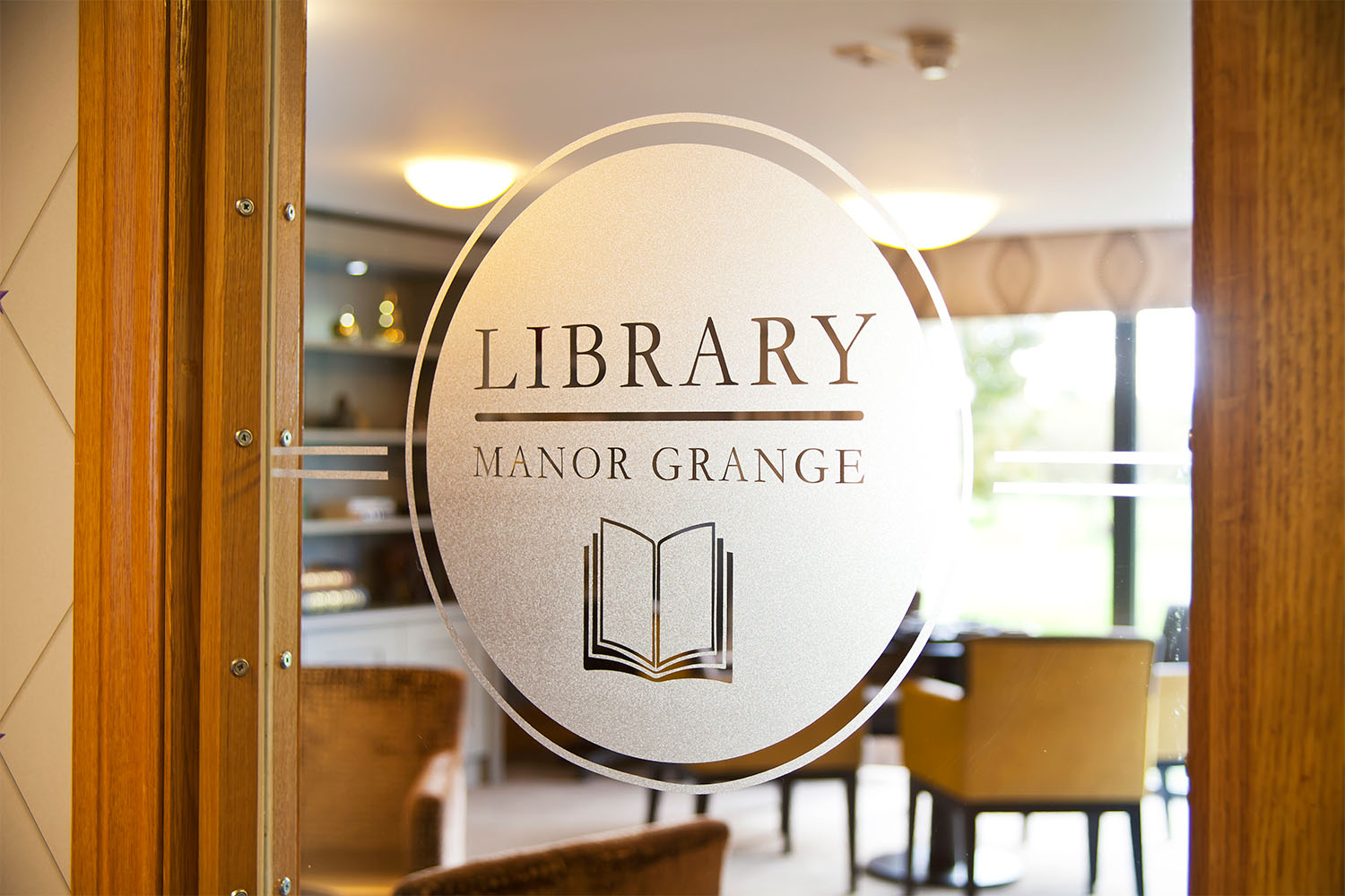 sign on a glass door of a care home library