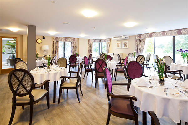 dining room at manor grange care home with purple chairs