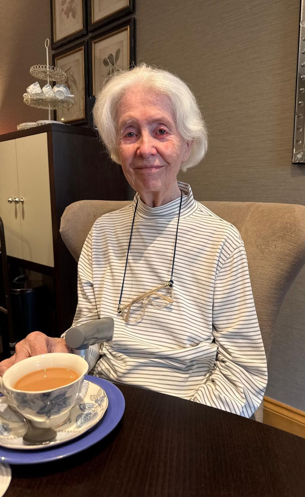 elderly woman with a cup of tea